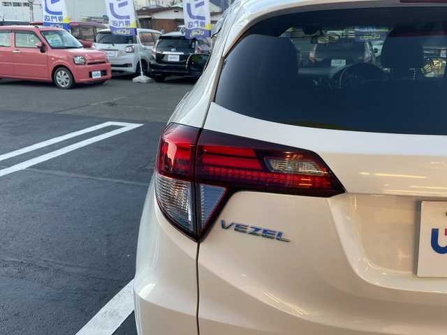 ホンダ ヴェゼル ハイブリッド X Lパッケージ 長野県 2014(平26)年 12.1万km ホワイトオーキッドパール 【(株)IDOMが運営する【じしゃロン長野店】の自社ローン対象車両になります。こちらは現金ご利用時の価格です。自社ローンご希望の方は別途その旨お申付け下さい。/社外ナビ/バックカメラ/ステアリングスイッチ/クルーズコントロール/シートヒーター/純正フロアマット/純正アルミホイール