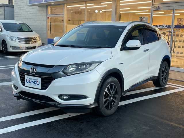 ホンダ ヴェゼル ハイブリッド X Lパッケージ 長野県 2014(平26)年 12.1万km ホワイトオーキッドパール 【(株)IDOMが運営する【じしゃロン長野店】の自社ローン対象車両になります。こちらは現金ご利用時の価格です。自社ローンご希望の方は別途その旨お申付け下さい。/社外ナビ/バックカメラ/ステアリングスイッチ/クルーズコントロール/シートヒーター/純正フロアマット/純正アルミホイール