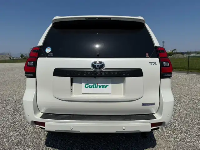 トヨタ ランドクルーザー プラド TX Lパッケージ マットブラED 愛知県 2023(令5)年 1.8万km ホワイトパールクリスタルシャイン 〇純正9インチディスプレイオーディオ/〇バックカメラ/〇パノラマモニター/〇ビルトインETC2.0/〇ドライブレコーダー/〇7人乗り/〇ムーンルーフ/〇セーフティセンス/〇レーダークルーズコントロール/〇プリクラッシュセーフティー/〇LEDヘッドランプ/〇オートライト/〇フォグランプ/〇純正18インチアルミ/〇パワーバッグドア/〇革巻きステアリング/〇左右独立オートエアコン/〇革シート/〇シートヒーター/〇シートベンチレーション/〇パワーシート/〇スマートエントリー/〇禁煙車