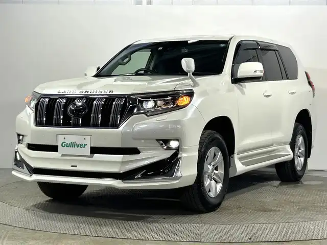 トヨタ ランドクルーザー プラド TX 大阪府 2022(令4)年 1.2万km ホワイトパールクリスタルシャイン サンルーフ モデリスタエアロ 社外ディスプレイオーディオ バックカメラ ETC 衝突軽減 レーダークルコン クリアランスソナー トヨタセーフティセンス ドラレコ ワンオーナー ４WD