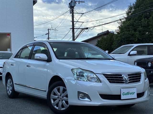 トヨタ プレミオ 1．5F Lパケ プライムグリーン 熊本県 2012(平24)年 10.1万km ホワイトパールクリスタルシャイン １オーナー/社外オーディオ/【AM/FM/USB/AUX/CD】/ウッドコンビステアリング/オートライト/ＨＩＤヘッドライト/フォグランプ/電格ミラー/スマートキー/プッシュスタート/純正フロアマット/純正ドアバイザー/純正ホイールキャップ/取扱説明書/保証書