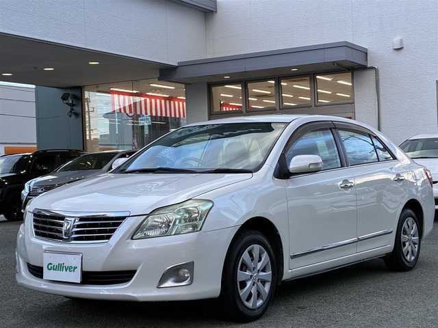 トヨタ プレミオ 1．5F Lパケ プライムグリーン 熊本県 2012(平24)年 10.1万km ホワイトパールクリスタルシャイン １オーナー/社外オーディオ/【AM/FM/USB/AUX/CD】/ウッドコンビステアリング/オートライト/ＨＩＤヘッドライト/フォグランプ/電格ミラー/スマートキー/プッシュスタート/純正フロアマット/純正ドアバイザー/純正ホイールキャップ/取扱説明書/保証書