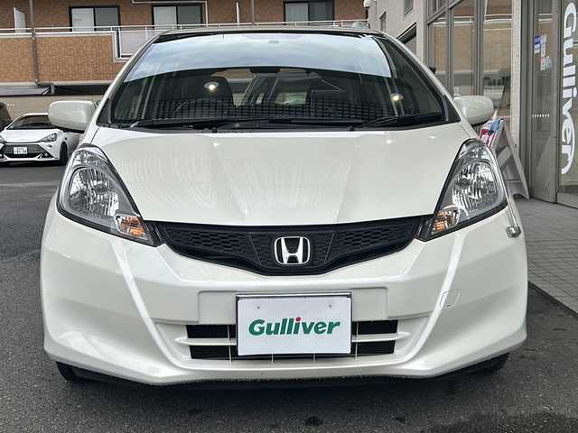 ホンダ フィット 13G 高知県 2013(平25)年 6.2万km プレミアムホワイトパール 純正オーディオ/ポータブルナビ/スペアキー