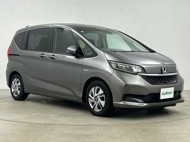 ホンダ フリード ハイブリット G ホンダセンシング 鹿児島県 2020(令2)年 5万km スーパープラチナグレーメタリック 純正9インチナビ/（AM/FM/CD/DVD/Bluetooth/フルセグ）/バックカメラ/ホンダセンシング/・衝突軽減ブレーキ/・レーンキープアシスト/・追従式クルーズコントロール/・クリアランスソナー/・オートマチックハイビーム/・先行者発信お知せ機能/ETC/前席シートヒーター/キャプテンシート/両側パワースライドドア/スマートキー/スペアキー有/純正15インチアルミホイール/純正フロアマット/横滑り防止装置/アイドリングストップ