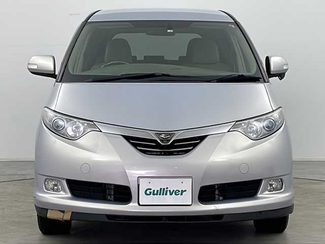 トヨタ エスティマ ハイブリッド G 道央・札幌 2006(平18)年 15.1万km ライトパープルマイカ ・4WD/・純正ナビ&BT&DVD&CD/・純正フリップダウンモニター/・バック、サイド(左)、フロントカメラ/・両側パワースライドドア/・パワーバックドア/・横滑り防止/・AFS/・AC100V、1500W電源付き/・クルーズコントロール/・運転席パワーシート/・アルカンターラシート/・木目革巻きコンビハンドル/・ETC/・スマートキー/・スペアキー