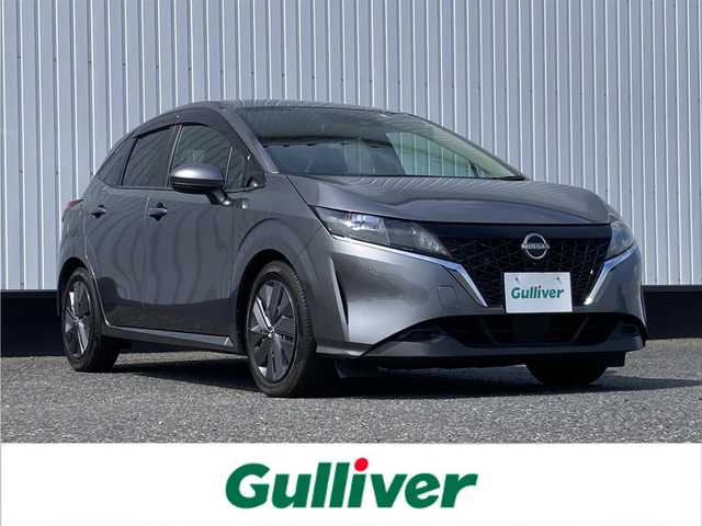 日産 ノート X 愛媛県 2022(令4)年 1.2万km ダークメタルグレー 純正9インチメモリナビ/(CD/DVD/BT/フルセグTV)/衝突被害軽減システム/車線逸脱警報/横滑り防止装置/ETC/ドライブレコーダー/オートライト/ウィンカーミラー/電動格納ミラー/プッシュスタート/スマートキー/フロアマット/ドアバイザー/取扱説明書