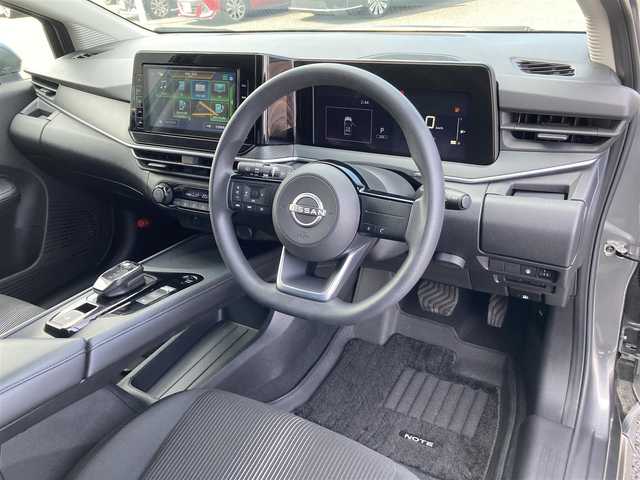 日産 ノート X 愛媛県 2022(令4)年 1.2万km ダークメタルグレー 純正9インチメモリナビ/(CD/DVD/BT/フルセグTV)/衝突被害軽減システム/車線逸脱警報/横滑り防止装置/ETC/ドライブレコーダー/オートライト/ウィンカーミラー/電動格納ミラー/プッシュスタート/スマートキー/フロアマット/ドアバイザー/取扱説明書