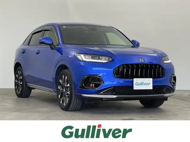 ホンダ ＺＲ－Ｖ ハイブリッド e:HEV Z 千葉県 2024(令6)年 1.4万km プレミアムクリスタルブルークリスタル 禁煙　/純正９型ホンダコネクトナビ　/AM＆FM＆Bluetooth＆フルセグTV/内装：マルーン/純正エアロ（F/S）/ＢＯＳＥサウンド　/全方位カメラ　/バックカメラ/ビルトインＥＴＣ２．０　/ホンダセンシング　/レーダークルーズコントロール　/ブラインドスポットモニター　/ワイヤレス充電　/シートヒーター/パドルシフト/ダウンヒルアシストコントロール/LEDヘッドライト/フォグランプ/自動防眩ルームミラー/電動トランク/運転席パワーシート（メモリー機能付き）/ISOFIX/アイドリングストップ/ウィンカーミラー/ドアバイザー/プッシュスタート