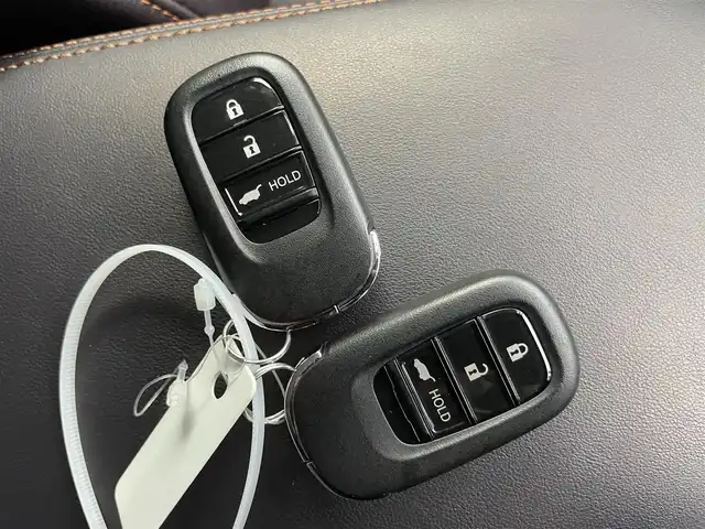 ホンダ ＺＲ－Ｖ ハイブリッド e:HEV Z 千葉県 2024(令6)年 1.4万km プレミアムクリスタルブルークリスタル 禁煙　/純正９型ホンダコネクトナビ　/AM＆FM＆Bluetooth＆フルセグTV/内装：マルーン/純正エアロ（F/S）/ＢＯＳＥサウンド　/全方位カメラ　/バックカメラ/ビルトインＥＴＣ２．０　/ホンダセンシング　/レーダークルーズコントロール　/ブラインドスポットモニター　/ワイヤレス充電　/シートヒーター/パドルシフト/ダウンヒルアシストコントロール/LEDヘッドライト/フォグランプ/自動防眩ルームミラー/電動トランク/運転席パワーシート（メモリー機能付き）/ISOFIX/アイドリングストップ/ウィンカーミラー/ドアバイザー/プッシュスタート