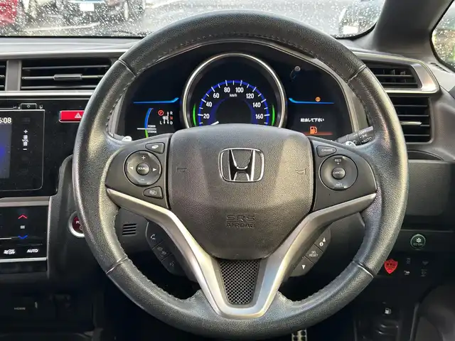 ホンダ フィット ハイブリット Sパッケージ 島根県 2015(平27)年 4.8万km ホワイトオーキッドパール 登録時走行距離47539km/Hondaインターナビ/Bluetooth/AM/FM/CD/DVD/HDMI/フルセグテレビ/バックカメラ/ETC/LEDヘッドライト/フォグランプ/プッシュスタート/スマートキー/あんしんパッケージ/純正フロアマット/純正16インチAW/ウィンカーミラー/ドアバイザー/パドルシフト/禁煙車