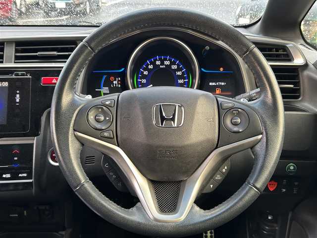 ホンダ フィット ハイブリット Sパッケージ 島根県 2015(平27)年 4.8万km ホワイトオーキッドパール 登録時走行距離47539km/Hondaインターナビ/Bluetooth/AM/FM/CD/DVD/HDMI/フルセグテレビ/バックカメラ/ETC/LEDヘッドライト/フォグランプ/プッシュスタート/スマートキー/あんしんパッケージ/純正フロアマット/純正16インチAW/ウィンカーミラー/ドアバイザー/パドルシフト/禁煙車