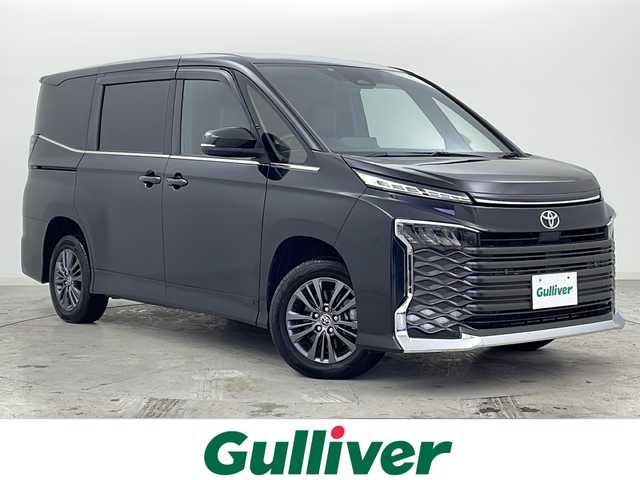 トヨタ ヴォクシー S－Z 宮城県 2023(令5)年 3.5万km グリッターブラックガラスフレーク 禁煙車/快適パッケージHigh/DVDデッキ/Toyota Safety Sense	/・プリクラッシュセーフティ/・レーントレーシングアシスト/・レーダークルーズコントロール/・プロアクティブドライビングアシスト/・オートマチックハイビーム/メーカーオプションナビ/・BT.CD.DVD.HDMI.USB/バックカメラ/両側パワースライドドア/パワバックドア/ビルトインETC2.0/ハーフレザーシート/シートヒーター(D.N.二列目)/革巻ステアリング/ステアリングスイッチ/ステアリングヒーター/プッシュスタート/スマートキー×2/純正フロアマッド/LEDヘッドライト/純正16インチアルミホイール/ロールサンシャード/純正ドアバイザー/アイドリングストップ/横滑り防止機能