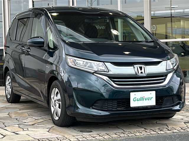 ホンダ フリード＋ ハイブリット G ホンダセンシング 静岡県 2019(令1)年 5.7万km フォレストグリーンパール 純正ナビ/・CD/DVD/・FM/AM/・TV/・SD/・Bluetooth/ホンダセンシング/●衝突軽減ブレーキ〈CMBS〉/●誤発進抑制機能/●ACC〈アダプティブ・クルーズ・コントロール〉/●LKAS〈車線維持支援システム〉/●歩行者事故低減ステアリング/●路外逸脱抑制機能/●先行車発進お知らせ機能/●標識認識機能/主要装備/・バックカメラ/・両側パワースライドドア/・ＥＴＣ/・ＬＥＤヘッドライト/・アクティブコーナリングライト/・ドライブレコーダー/・純正フロアマット/・横滑り防止装置