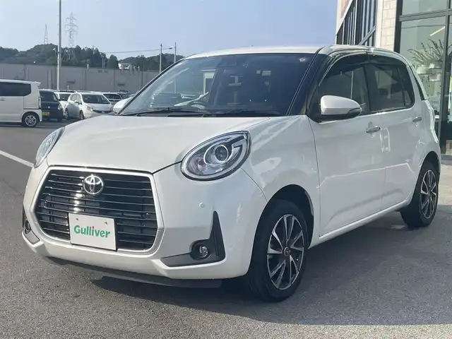 トヨタ パッソ モーダ　Gパッケージ 愛媛県 2020(令2)年 1.6万km パールホワイトⅢ 純正ナビ（Bluetooth/SD/CD/DVD/フルセグTV)/バックカメラ/ビルドインETC/前方ドライブレコーダー/社外15インチアルミホイール/純正フロアマット/純正ドアバイザー/LEDヘッドライト/フォグランプ/オートマチックハイビーム/パーキングセンサー/ABS/横滑り防止装置/衝突被害軽減ブレーキ/電動格納ミラー/プッシュスタート/スマートキー