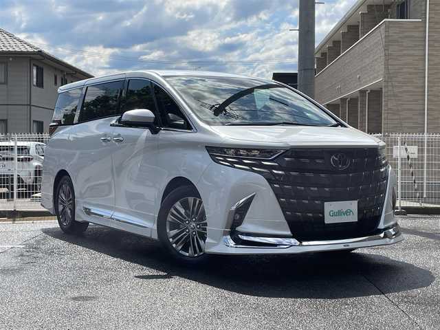 トヨタ アルファード Z 福島県 2025(令7)年 0.1万km プラチナホワイトパールマイカ ワンオーナー/ディスプレイオーディオPlus/AM/FM/BT/USB/HDMI/Miracast/フルセグTV/MODELLISTA エアロパーツセット/（REGAL DIGNITY STYLE）/左右独立ムーンルーフ/13.2型有機EL後席ディスプレイ/デジタルインナーミラー/パノラミックビューモニター/トヨタセーフティセンス/レーダークルーズコントロール/クリアランスソナー/ブラインドスポットモニター/両側パワースライドドア/パワーバックドア/合成皮革ブラックレザーシート/パワーシート/シートヒーター/エアシート/ステアリングヒーター/オートハイビーム/3眼LEDヘッドライト/ビルトインETC 2.0/USB充電ポート/おくだけ充電/フロアマット