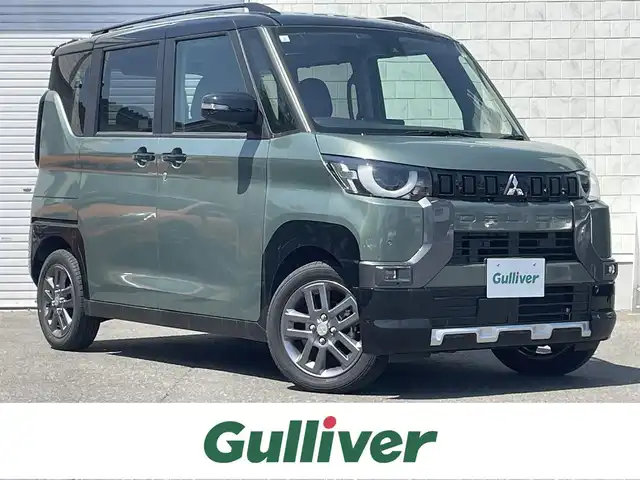 三菱 デリカミニ T プレミアム 道東・釧路十勝 2024(令6)年 0.7万km Ｌグリーン 4WD/MI-PILOT/社外ナビ/地デジ/アラウンドビューモニター/デジタルインナーミラー/衝突軽減ブレーキ/ステアリングヒーター/シートヒーター /両側パワースライドドア/コーナーセンサー/ETC/LEDヘッドライト/フォグランプ/電子パーキング/オートホールド/レーダークルーズコントロール/パドルシフト/オートライト/ハーフレザーシート