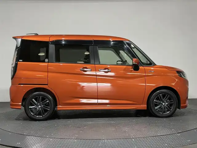 スズキ ソリオ HV SZ 愛媛県 2023(令5)年 1.3万km フレイムオレンジPM ・１０型ナビ/（フルセグＴＶ・ＢＴ・ＣＤ・ＤＶＤ・ＳＤ・ＦＭ・ＡＭ・ＵＳＢ）/・全方位カメラ　/・前後ドラレコ　/・両側パワースライドドア　/・ＤＮ席シートヒーター　/・ＵＳＢ充電　/・レーダークルーズコントロール/・レーンキープアシスト/・ヘッドアップディスプレイ/・サーキュレーター