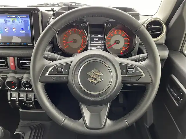 スズキ ジムニー シエラ JC 群馬県 2024(令6)年 0.5万km ミディアムグレー 社外ケンウッド8型ナビ(MDV-S810L)/・CD/DVD/USB/Bluetooth/フルセグTV/=====/ケンウッド８インチナビ　フルセグＴＶ　バックカメラ　衝突軽減　クルーズコントロール　シートヒーター　ＬＥＤヘッドライト　バックソナー　ＥＴＣ　ミラー型ドライブレコーダー　スマートキー　４ＷＤ　禁煙車