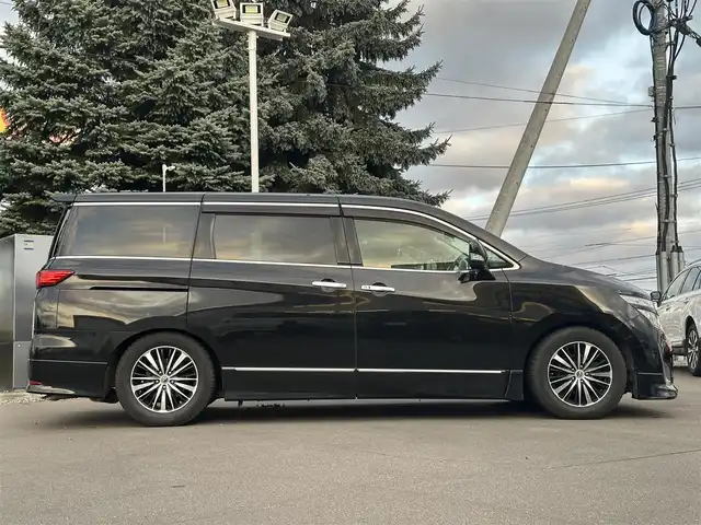 日産 エルグランド 250ハイウェイスター 道北・旭川 2012(平24)年 12.5万km ファントムブラック (株)IDOMが運営する【じしゃロン旭川店】の自社ローン専用車両になります。こちらは現金またはオートローンご利用時の価格です。自社ローンご希望の方は別途その旨お申付け下さい/　/・純正ナビ(CD/DVD/BT/SD/フルセグ)/・バックカメラ/・ETC/・両側パワースライドドア/・電動格納ウィンカーミラー/・フロントデアイサー/・リアデフォッガー/・オートライト/・プッシュスタート/・スマートキー1個/・フォグランプ/・現車装着スタッドレスタイヤ 純正AW225/60R17/・取扱説明書