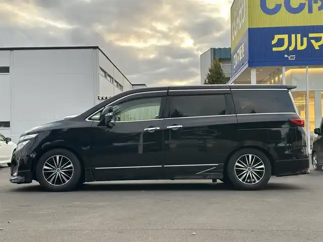 日産 エルグランド 250ハイウェイスター 道北・旭川 2012(平24)年 12.5万km ファントムブラック (株)IDOMが運営する【じしゃロン旭川店】の自社ローン専用車両になります。こちらは現金またはオートローンご利用時の価格です。自社ローンご希望の方は別途その旨お申付け下さい/　/・純正ナビ(CD/DVD/BT/SD/フルセグ)/・バックカメラ/・ETC/・両側パワースライドドア/・電動格納ウィンカーミラー/・フロントデアイサー/・リアデフォッガー/・オートライト/・プッシュスタート/・スマートキー1個/・フォグランプ/・現車装着スタッドレスタイヤ 純正AW225/60R17/・取扱説明書