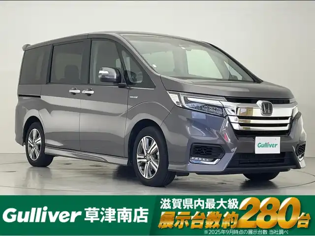 ホンダ ステップワゴン スパーダ ハイブリッド G EX ホンダセンシング 滋賀県 2019(平31)年 4.7万km モダンスティールM 純正メモリーナビ/【Bluetooth/CD/DVD/USB/フルセグ】/両側パワースライドドア/・ハンズフリー左スライドドア/バックカメラ/ハーフレザーシート/シートヒーター/LEDヘッドライト/フォグライト/純正１６AW/ビルトインETC/スマートキー/ドライブレコーダー