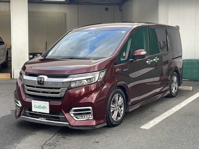 ホンダ ステップワゴン スパーダ ハイブリッド G EX ホンダセンシング 京都府 2018(平30)年 7.9万km プレミアムディープロッソパール 純正９インチナビ　Ｂｌｕｅｔｏｏｔｈオーディオ　ＤＶＤ再生　ＨＤＭＩ　ＵＳＢ　マルチビューモニター　後席フリップダウンモニター　両側パワースライド　アダプティブクルーズコントロール　車高調　ＬＥＤヘッドライト　スマートキー　前後ドライブレコーダー