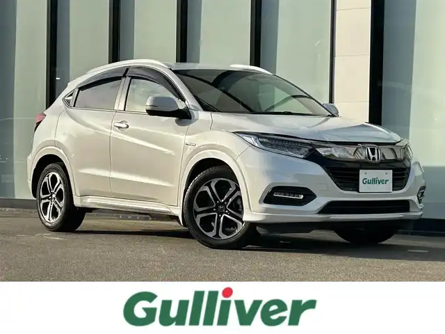 ホンダ ヴェゼル ハイブリッド Z ホンダセンシング 大阪府 2019(令1)年 2.5万km プラチナホワイトパール 純正８インチナビ/   フルセグTV/CD/DVD/USB/衝突軽減/バックモニター/前席シートヒーター/レーダークルーズコントロール/前後ドライブレコーダー/純正フロアマット/プッシュスタート/スマートキー/ＥＴＣ/ＬＥＤライト/禁煙車