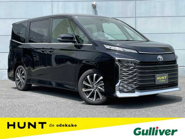 トヨタ ヴォクシー S－Z 千葉県 2023(令5)年 0.3万km アティチュードブラックマイカ ワンオーナー/快適利便パッケージ/ユニバーサルステップ/衝突軽減ブレーキ/両側パワースライドドア/純正フリップダウンモニター/純正１０インチナビ/フルセグＴＶ/バックカメラ/パワーバックドア/シートヒーター