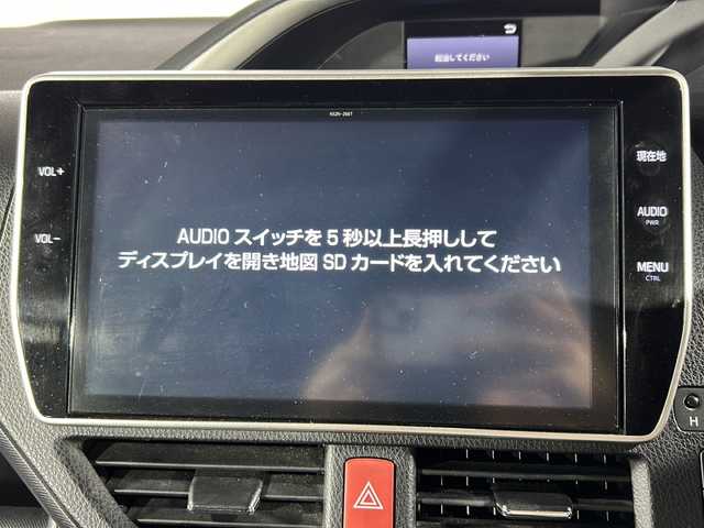 トヨタ ヴォクシー ハイブリッド ZS 煌 沖縄県 2018(平30)年 5.6万km イナズマスパーキングブラックガラスフレーク 禁煙車/県外仕入/7人乗り/純正10インチナビ/（フルセグTV/bluetooth/DVD/CD）/12.1インチフリップダウンモニター/前後ドライブレコーダー/モデリスタエアロ/フロントスポイラー/スタイリッシュモール/リアスカート/シグネチャーイルミブレード/トヨタセーフティセンス/プリクラッシュセーフティ/レーンディパーチャーアラート/オートマチックハイビーム/両側パワースライドドア/前席シートヒーター/ビルトインETC/純正フロアマット
