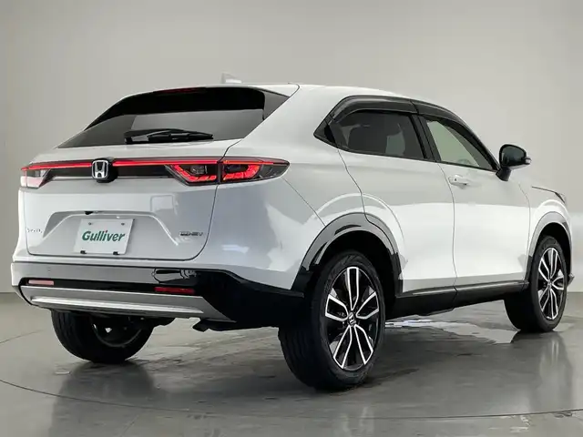 ホンダ ヴェゼル ハイブリッド e:HEV Z 愛知県 2022(令4)年 2.7万km プラチナホワイトパール 純９型ナビＤＡ　ワイヤレス充電　禁煙車　フルセグＴＶ　バックカメラ　ＥＴＣ２．０　ハンズフリーパワーバックドア　ホンダセンシング　追従クルコン　衝突軽減　ＬＥＤオートライト　後退出庫サポート　ＢＳＭ/ワイパーデアイサー/ワイヤレス充電/フォグランプ/ステアリングヒーター/ブラインドスポットモニター/パドルシフト/Bluetooth/純正アルミホイール/オートハイビーム/純正ドライブレコーダー/純正ナビ/ETC/バックカメラ