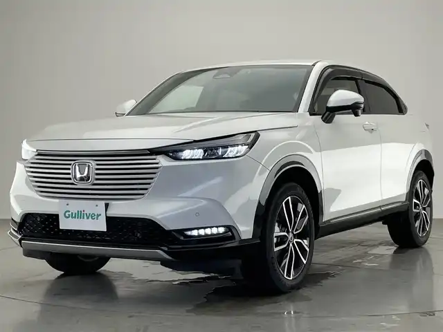 ホンダ ヴェゼル ハイブリッド e:HEV Z 愛知県 2022(令4)年 2.7万km プラチナホワイトパール 純９型ナビＤＡ　ワイヤレス充電　禁煙車　フルセグＴＶ　バックカメラ　ＥＴＣ２．０　ハンズフリーパワーバックドア　ホンダセンシング　追従クルコン　衝突軽減　ＬＥＤオートライト　後退出庫サポート　ＢＳＭ/ワイパーデアイサー/ワイヤレス充電/フォグランプ/ステアリングヒーター/ブラインドスポットモニター/パドルシフト/Bluetooth/純正アルミホイール/オートハイビーム/純正ドライブレコーダー/純正ナビ/ETC/バックカメラ