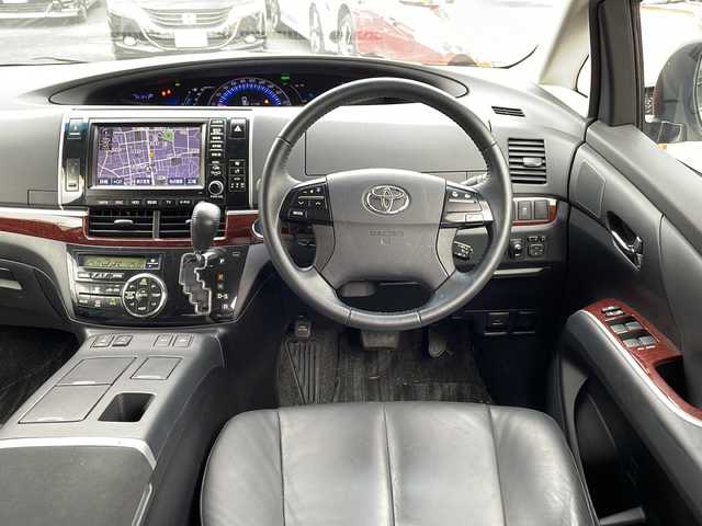 トヨタ エスティマ ハイブリッド アエラス レザーパッケージ 東京都 2014(平26)年 3.6万km ホワイトパールクリスタルシャイン 新車時保証書　/取扱説明書　ナビ説明書/TRDフロントスポイラー/モデリスタフロントグリル/純正メーカーナビ/フルセグTV【走行中映ります】/CD/DVD/REC/USB/AUX/フリップダウンモニター/バックカメラ　ETC/ドライブレコーダー【前後】/レザーシート/シートヒーター/運転席パワーシート/両側パワースライドドア/パワーバックドア/電動床下格納シート/コーナーセンサー/HIDライト/オートライト/Egプッシュスタート/ ストップボタン/スマートキー×2本/クルーズコントロール/社外ホーン【純正積込】/純正17インチアルミ