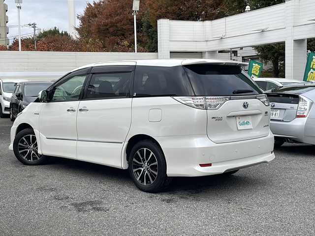 トヨタ エスティマ ハイブリッド アエラス レザーパッケージ 東京都 2014(平26)年 3.6万km ホワイトパールクリスタルシャイン 新車時保証書　/取扱説明書　ナビ説明書/TRDフロントスポイラー/モデリスタフロントグリル/純正メーカーナビ/フルセグTV【走行中映ります】/CD/DVD/REC/USB/AUX/フリップダウンモニター/バックカメラ　ETC/ドライブレコーダー【前後】/レザーシート/シートヒーター/運転席パワーシート/両側パワースライドドア/パワーバックドア/電動床下格納シート/コーナーセンサー/HIDライト/オートライト/Egプッシュスタート/ ストップボタン/スマートキー×2本/クルーズコントロール/社外ホーン【純正積込】/純正17インチアルミ