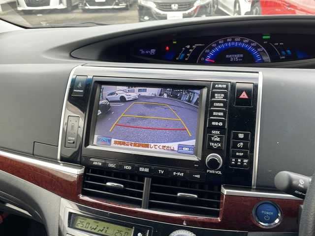 トヨタ エスティマ ハイブリッド アエラス レザーパッケージ 東京都 2014(平26)年 3.6万km ホワイトパールクリスタルシャイン 新車時保証書　/取扱説明書　ナビ説明書/TRDフロントスポイラー/モデリスタフロントグリル/純正メーカーナビ/フルセグTV【走行中映ります】/CD/DVD/REC/USB/AUX/フリップダウンモニター/バックカメラ　ETC/ドライブレコーダー【前後】/レザーシート/シートヒーター/運転席パワーシート/両側パワースライドドア/パワーバックドア/電動床下格納シート/コーナーセンサー/HIDライト/オートライト/Egプッシュスタート/ ストップボタン/スマートキー×2本/クルーズコントロール/社外ホーン【純正積込】/純正17インチアルミ