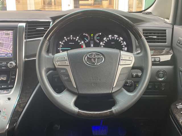 トヨタ ヴェルファイア 2．4Z Gエディション 青森県 2014(平26)年 9.6万km ホワイトパールクリスタルシャイン 4WD/純正メーカーHDDナビ・フルセグTV/CD・DVD・Bluetooth・USB/OPプレミアムサウンド18スピーカー/OPリアエンターテイメントシステム/純正9インチ後席モニター/OPパノラミックビューモニター/前席パワーシート/両側パワースライドドア/パワーバックドア/クルーズコントロール/クリアランスソナー/ワイパーデアイサー/社外ドラレコ一体型デジタルインナーミラー/ビルトインETC/AC100V100W/純正エンジンスターター/HIDヘッドライト/HIDフォグランプ/純正18インチアルミ/モデリスタフロントグリル