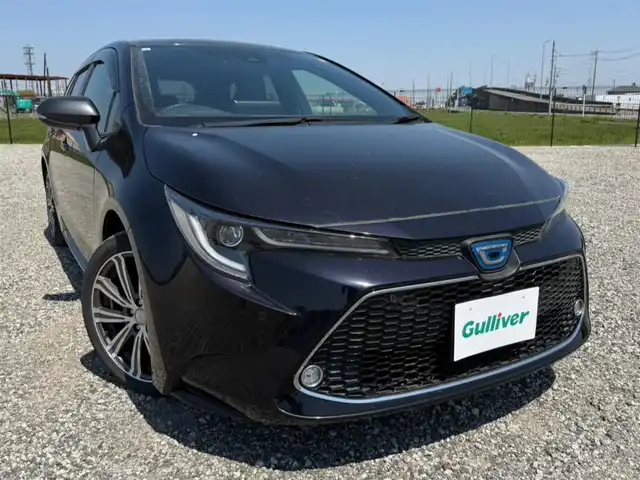 トヨタ カローラツーリング ハイブリッド ダブルバイビー 愛知県 2021(令3)年 6.8万km スパークリングブラックパールクリスタルシャイン 純正ナビ(BT/AM/FM)/フルセグTV/バックカメラ/ビルトインETC2.0/レーダークルーズコントロール/インテリジェントクリアランスソナー/セーフティセンス/・プリクラッシュセーフティ/・レーントレーシングアシスト/・オートマチックハイビーム/・ロードサインアシスト/丸型1灯式LEDヘッドランプ/オートライト/オートエアコン/本革巻きステアリング/合皮/レザテックコンビスポーティシート/スマック17インチアルミホイール/スマートエントリー/スタートシステム