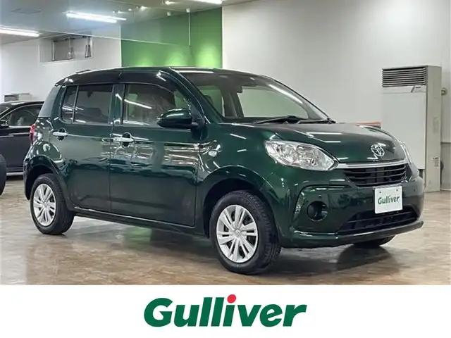 トヨタ パッソ X Lパッケージ 道央・札幌 2023(令5)年 0.7万km ダークエメラルドマイカ 4WD/寒冷地仕様/ワンオーナー/純正SDナビ（NSZT-W68T）/フルセグ/CD/DVD/BT/SD/バックカメラ/衝突軽減ブレーキ/横滑り防止/アイドリングストップ/純正エンジンスターター/シートヒーター/オートライト/オートマチックハイビーム/フロントワイパーデアイサー/クリアランスソナー/プッシュスタート/スマートキー×2/ビルトインETC/純正フロアマット/純正ドアバイザー/社外AW付サマータイヤセット積込み/　165/65/14　2022年製　5mm/保証書/取扱説明書