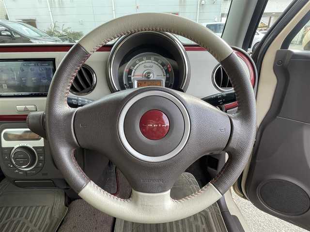 スズキ ラパン ショコラ X 東京都 2014(平26)年 6.7万km ベージュ ナビゲーション　/フルセグテレビ　/ＣＤ＆ＤＶＤ　/ブルートゥース　/バックカメラ　/ＥＴＣ　/アイドリングストップ　/スマートキー　/合革シート　/シートヒーター　/アイドリングストップ　/保証書　/取扱説明書　/整備手帳