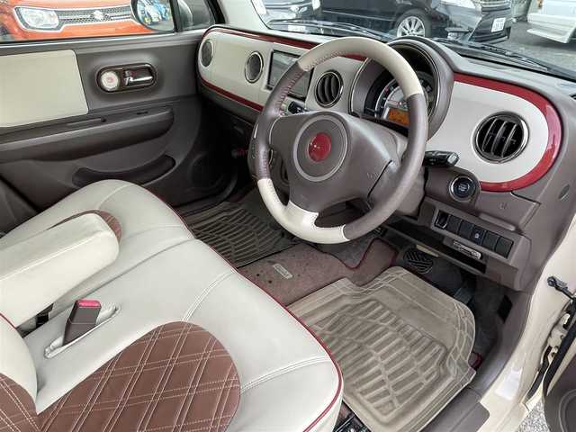 スズキ ラパン ショコラ X 東京都 2014(平26)年 6.7万km ベージュ ナビゲーション　/フルセグテレビ　/ＣＤ＆ＤＶＤ　/ブルートゥース　/バックカメラ　/ＥＴＣ　/アイドリングストップ　/スマートキー　/合革シート　/シートヒーター　/アイドリングストップ　/保証書　/取扱説明書　/整備手帳