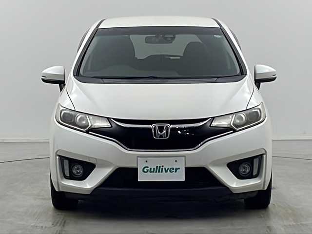 ホンダ フィット 13G Sパッケージ 栃木県 2015(平27)年 15.9万km プレミアムホワイトパールⅡ シティブレーキアシスト/純正ナビ/　フルセグ/CD/DVD/AM/FM/SD/BT/バックカメラ/オートライト/フォグランプ/電格ウィンカーミラー/クルーズコントロール/ステアリングスイッチ/パドルシフト/ドライブレコーダー/プッシュスタート/スマートスペアキー/純正リヤスポイラー/純正15インチAW付185/60夏タイヤ車載