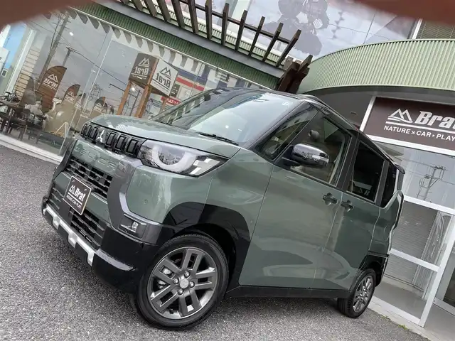 三菱 デリカミニ T プレミアム 福島県 2024(令6)年 0.1万km未満 緑Ｍ ・ルーフレール/・４WDターボ/・デジタルルームミラー/・アラウンドモニター付き/・LEDヘッドライト/・レーンキープアシスト/・両側パワースライドドア/・ハンズフリーオートスライドドア/・衝突軽減ブレーキ/・前席シートヒーター/・レーダークルーズコントロール