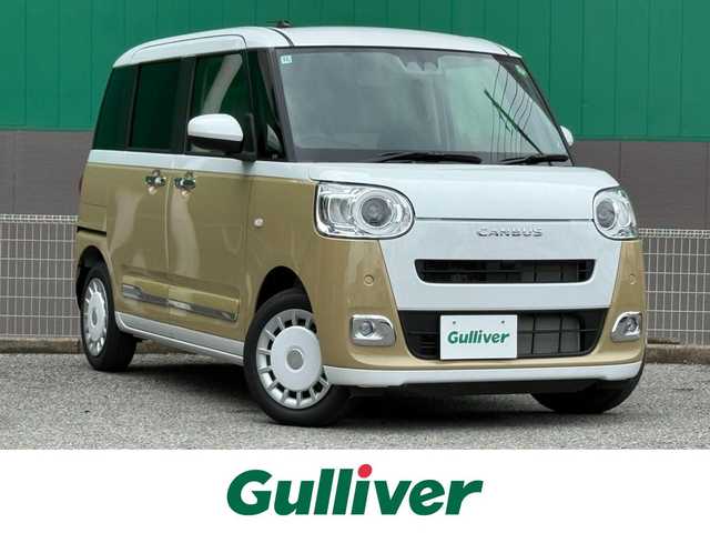 ダイハツ ムーヴ キャンバス ストライプス G 千葉県 2024(令6)年 0.1万km未満 シャイニングホワイトパール/サンドベージュメタリック 純正ナビ（NMZK-W73D）/　（BT/DVD/CD/AM/FM)/両側パワースライドドア/バックカメラ/前席　シートヒーター/保温機能付きカップホルダー/スマートアシスト/　・衝突回避支援/　・車線逸脱警報/　・コーナーセンサー/　・オートハイビーム/スペアキー/取扱説明書/保証書