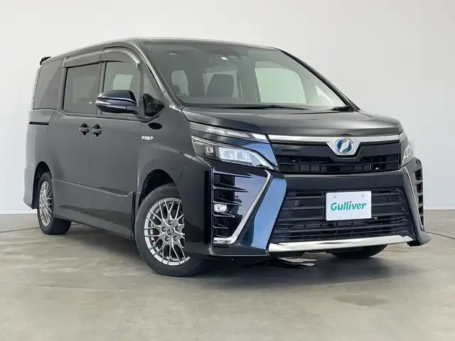 トヨタ ヴォクシー ハイブリッド ZS 新潟県 2019(令1)年 3.7万km ブラッキッシュアゲハガラスフレーク 純正9インチナビ/CD DVD BT フルセグTV/バックカメラ/片側パワースライドドア/ETC/クルーズコントロール/シートヒーター/トヨタセーフティセンス/PCS/LKA/オートハイビーム/LEDヘッドライト