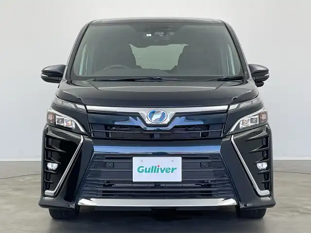 トヨタ ヴォクシー ハイブリッド ZS 新潟県 2019(令1)年 3.7万km ブラッキッシュアゲハガラスフレーク 純正9インチナビ/CD DVD BT フルセグTV/バックカメラ/片側パワースライドドア/ETC/クルーズコントロール/シートヒーター/トヨタセーフティセンス/PCS/LKA/オートハイビーム/LEDヘッドライト