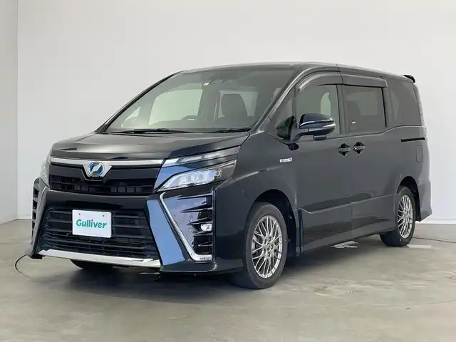 トヨタ ヴォクシー ハイブリッド ZS 新潟県 2019(令1)年 3.7万km ブラッキッシュアゲハガラスフレーク 純正9インチナビ/CD DVD BT フルセグTV/バックカメラ/片側パワースライドドア/ETC/クルーズコントロール/シートヒーター/トヨタセーフティセンス/PCS/LKA/オートハイビーム/LEDヘッドライト