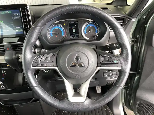 三菱 デリカミニ T プレミアム 愛知県 2023(令5)年 1.8万km 緑 ４ＷＤ/e-assist/・衝突軽減/・踏み間違え/・ロードサイン/・先行発進警告装置/・レーンディパラーチャー/・アダプティブクルーズコントロール/純正ディスプレイオーディオ/・Bluetooth/・Applecarplay/・androidauto/・HDMI/シートヒーター/両側パワースライド/パドルシフト/デジタルインナーミラー/ステアリングヒーター/前後ドライブレコーダー/LANDFOOTアルミホイール/マットガード
