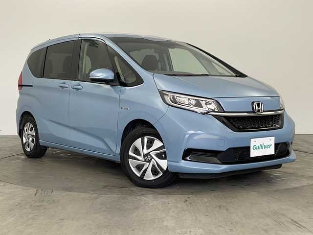 ホンダ フリード ハイブリット G ホンダセンシング 兵庫県 2020(令2)年 4.8万km シーグラスブルーパール ・純正ナビ/Bluetooth/CD/DVD/USB/・バックカメラ/・ホンダセンシング/・衝突軽減ブレーキ/・レーンディバーチャーアラート/・レーンキープアシスト/・レーダークルーズコントロール/・横滑り防止装置/・コーナーセンサー/・両側パワースライドドア/・ステアリングリモコン/・オートワイパー/・純正フロアマット/・シートヒーター/・ロールサンシェード/・LEDヘッドライト/・W＋サイドエアバッグ/・純正前方ドライブレコーダー/・ビルトインETC/・プッシュスタートボタン/・スマートキー/・スペアキー