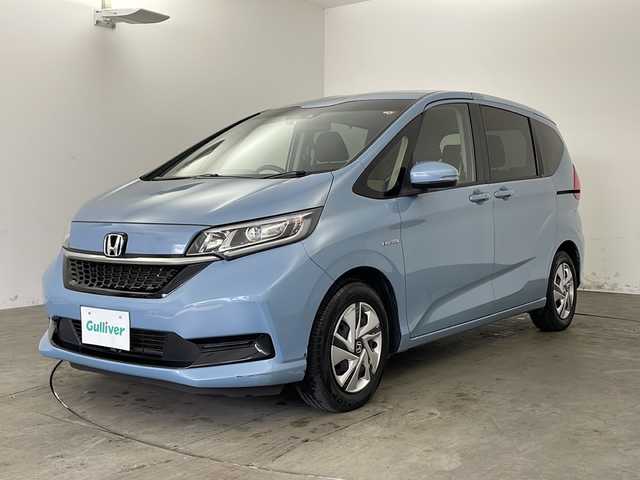 ホンダ フリード ハイブリット G ホンダセンシング 兵庫県 2020(令2)年 4.8万km シーグラスブルーパール ・純正ナビ/Bluetooth/CD/DVD/USB/・バックカメラ/・ホンダセンシング/・衝突軽減ブレーキ/・レーンディバーチャーアラート/・レーンキープアシスト/・レーダークルーズコントロール/・横滑り防止装置/・コーナーセンサー/・両側パワースライドドア/・ステアリングリモコン/・オートワイパー/・純正フロアマット/・シートヒーター/・ロールサンシェード/・LEDヘッドライト/・W＋サイドエアバッグ/・純正前方ドライブレコーダー/・ビルトインETC/・プッシュスタートボタン/・スマートキー/・スペアキー