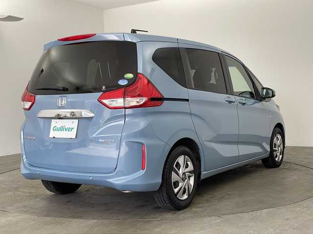 ホンダ フリード ハイブリット G ホンダセンシング 兵庫県 2020(令2)年 4.8万km シーグラスブルーパール ・純正ナビ/Bluetooth/CD/DVD/USB/・バックカメラ/・ホンダセンシング/・衝突軽減ブレーキ/・レーンディバーチャーアラート/・レーンキープアシスト/・レーダークルーズコントロール/・横滑り防止装置/・コーナーセンサー/・両側パワースライドドア/・ステアリングリモコン/・オートワイパー/・純正フロアマット/・シートヒーター/・ロールサンシェード/・LEDヘッドライト/・W＋サイドエアバッグ/・純正前方ドライブレコーダー/・ビルトインETC/・プッシュスタートボタン/・スマートキー/・スペアキー