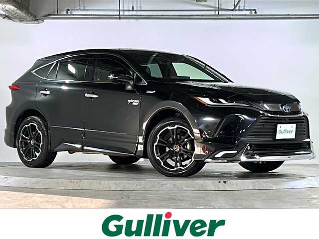 トヨタ ハリアー ハイブリッド Z レザーパッケージ 広島県 2020(令2)年 6.9万km プレシャスブラックパール モデリスタエアロ（F/S/R）/トヨタセーフティセンス/・プリクラッシュセーフティ/・レーンディパーチャーアラート/・LTA/・先行車発進告知/・RSA/・レーダークルーズコントロール/クリアランスソナー/HUD/BSM/RCTA/デジタルインナーミラー/パワーバックドア/JBLプレミアムサウンド/純正12.3インチナビ/・フルセグ/Bluetooth/USB/パノラミックビューモニター/ステアリングヒーター/革巻きステアリング/ステアリングスイッチ/黒革シート/シートヒーター/ベンチレーション/パワーシート/シートメモリー/ETC2.0/純正ドアバイザー/社外19インチアルミホイール/W+サイド+カーテンエアバック